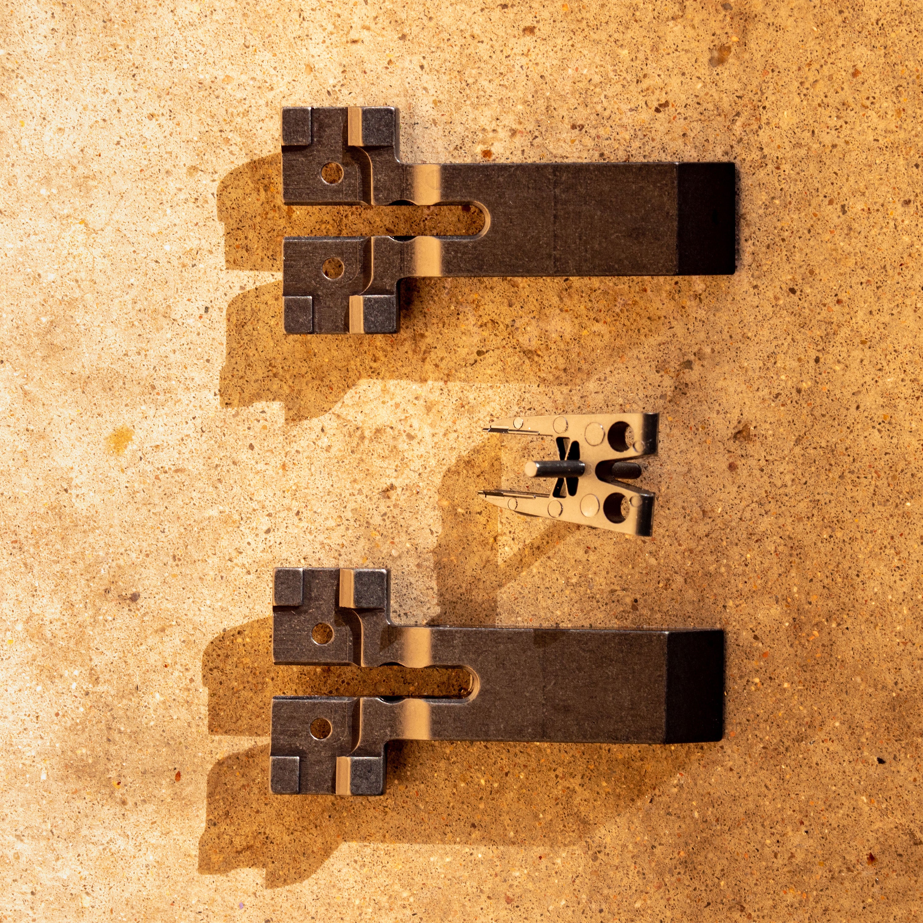 Gen 3 V2 Jaws for 1/4" Blades in desert sand at close-up from top-down angle.