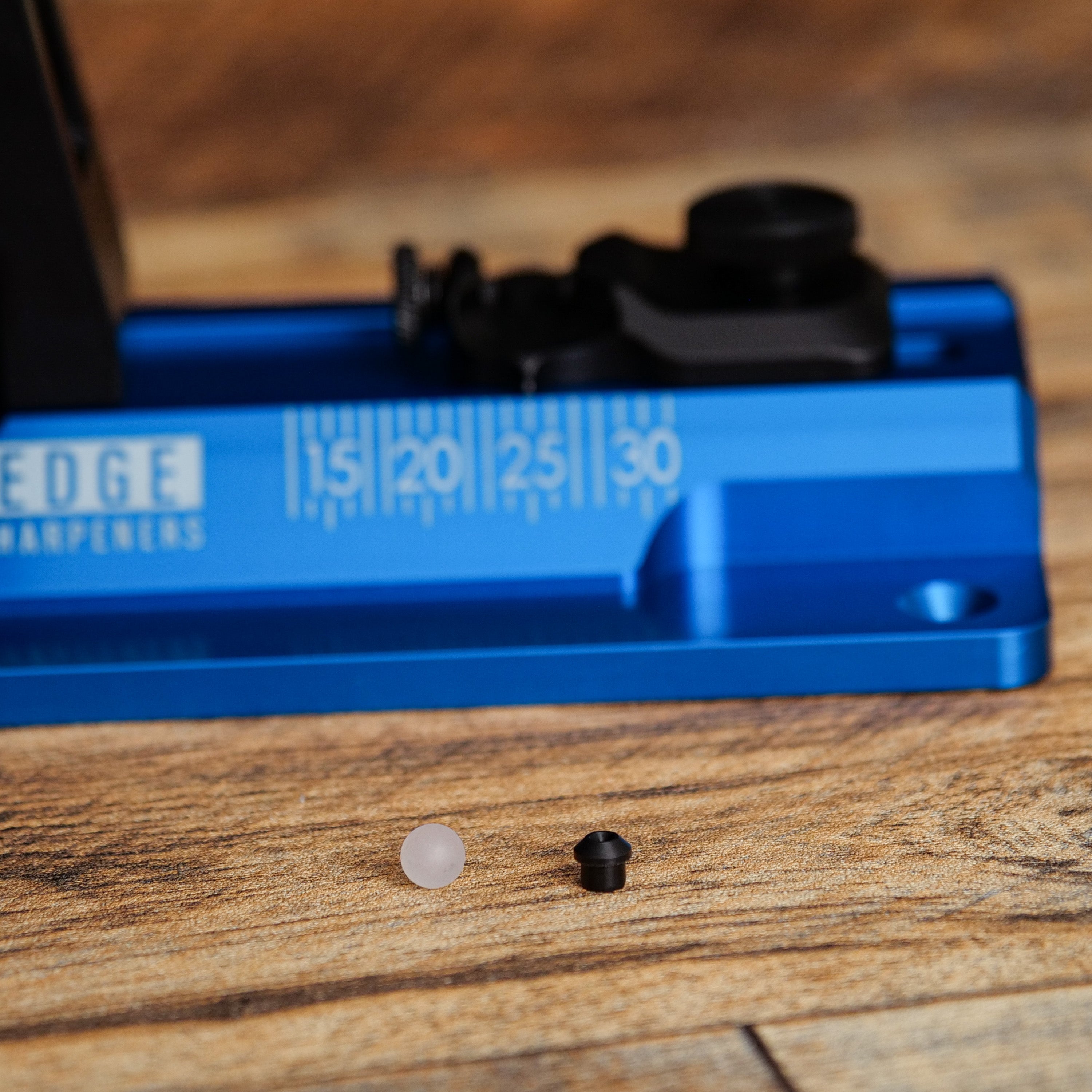 60 Series Pivot Race Parts Pack in close-up detail shot on wooden surface.