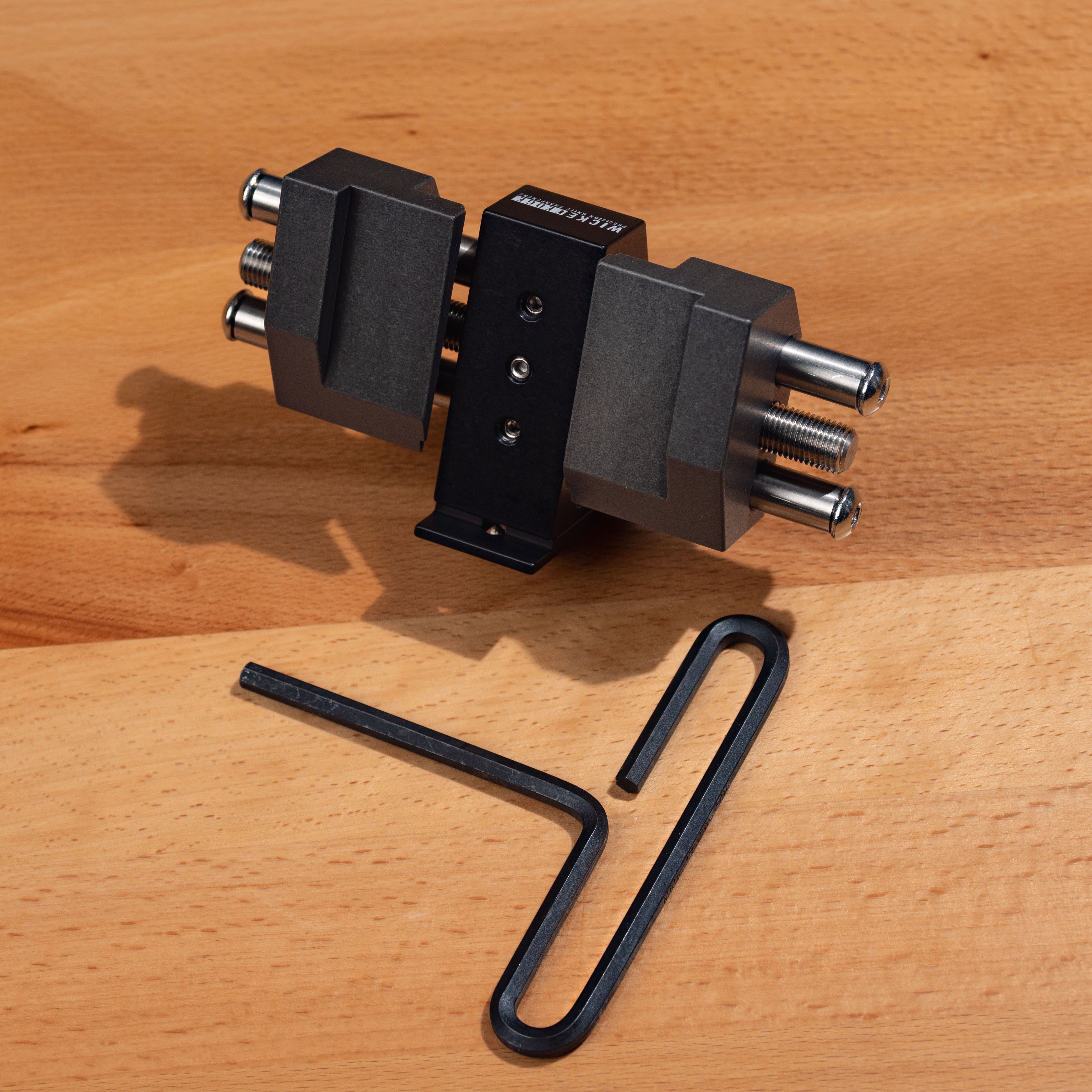 Chisel Attachment in close-up on wooden surface from high angle.