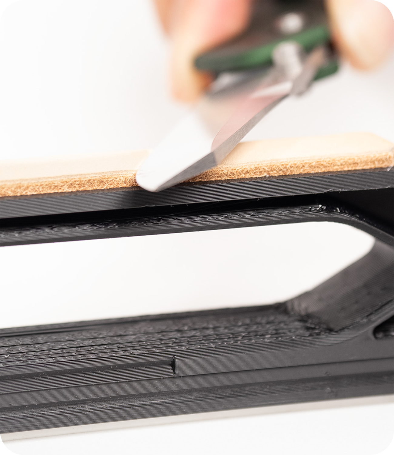 Close up view of knife being stropped on the WE26 Venture Pro
