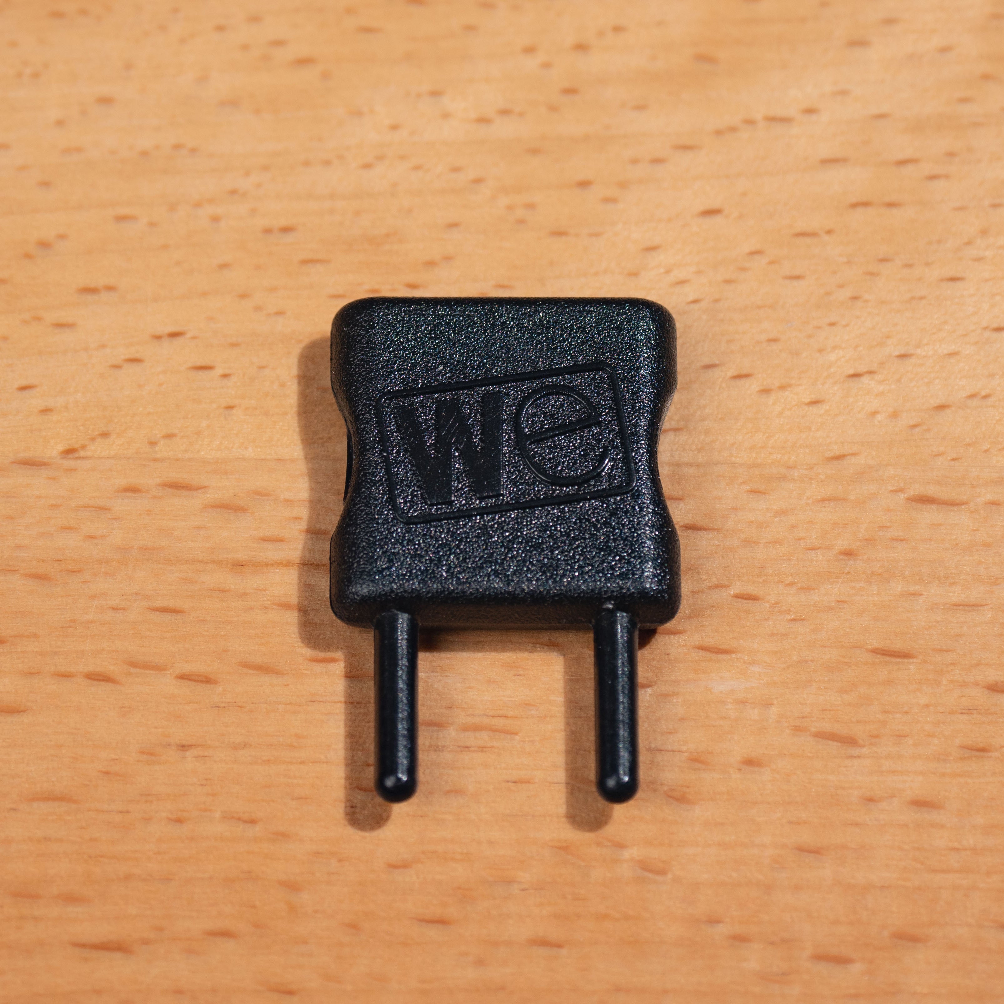 Depth Key accessory in close-up detail shot from above on light wood surface.