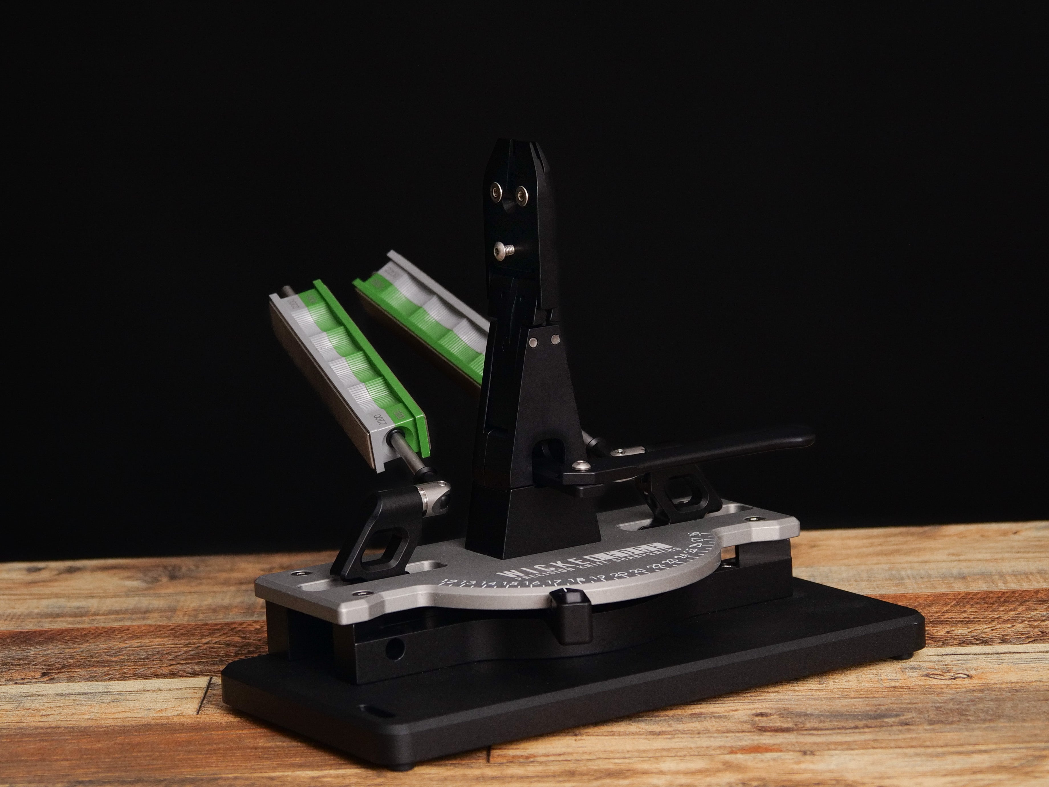 Low Angle & Small Knife Adapter in close-up view on wooden surface from front angle.