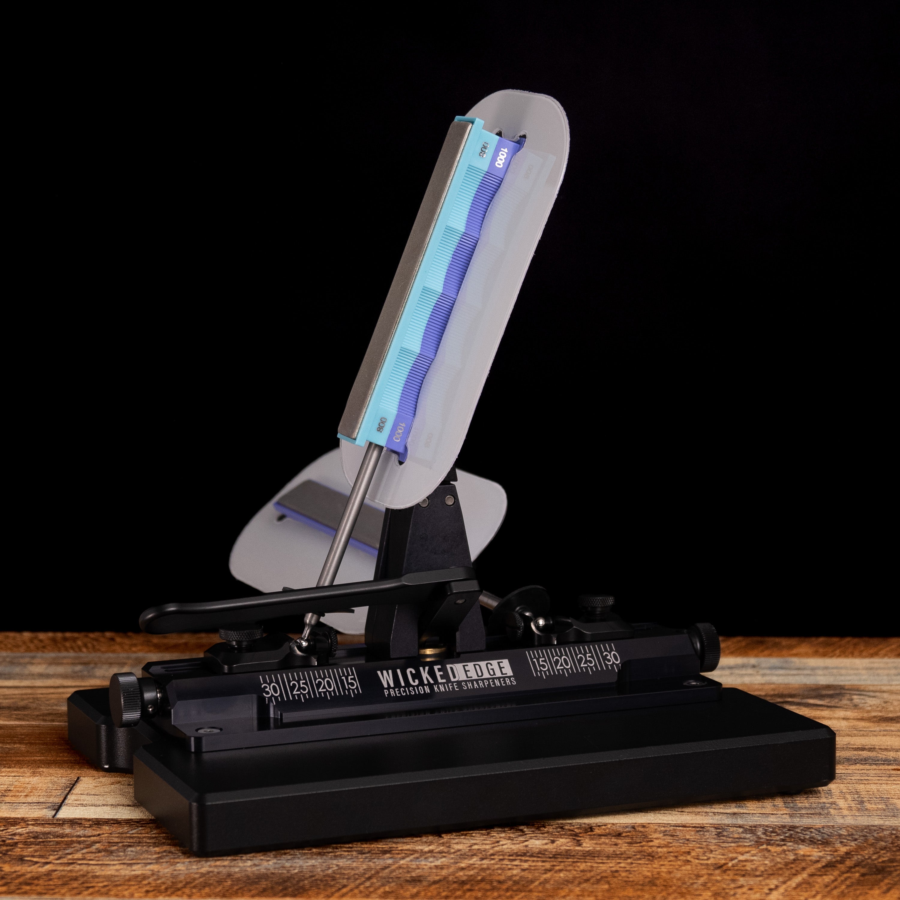 Wicked Edge Safety Shield (2 pack) mounted on sharpener base at close-up from front angle.