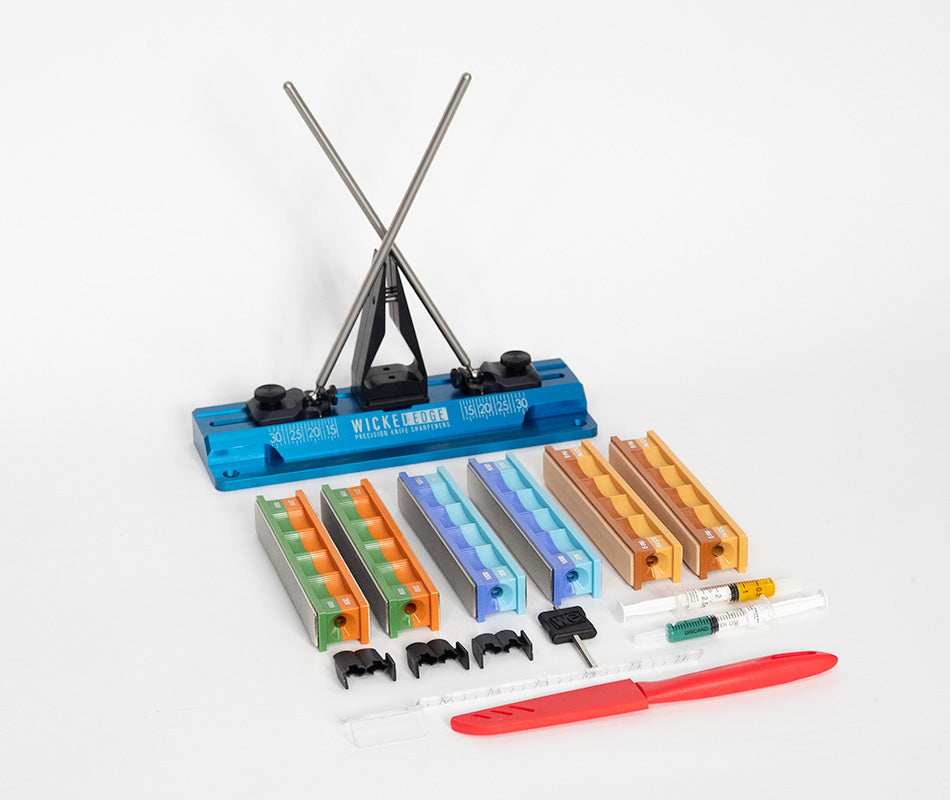 Wicked Edge GO-WE60 precision knife sharpener bundle in studio setting at close-up from front angle.
