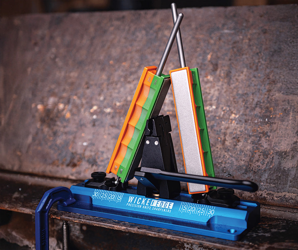 Wicked Edge Cobalt WE64 precision knife sharpener in workshop at close-up from front angle.