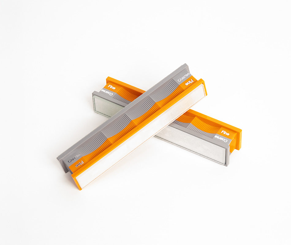 Blank glass platen handles in neutral scene at close-up from top-down angle.