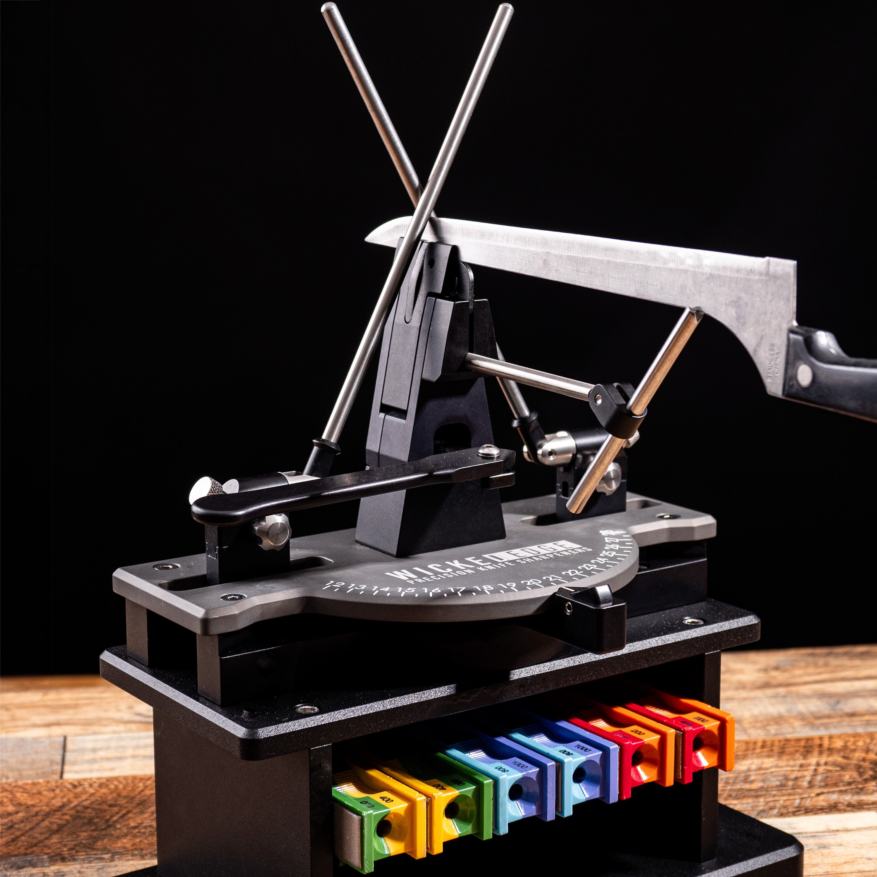 Wicked Edge Blade Stabilizer mounted in the WE411 precision knife sharpener. Front view.
