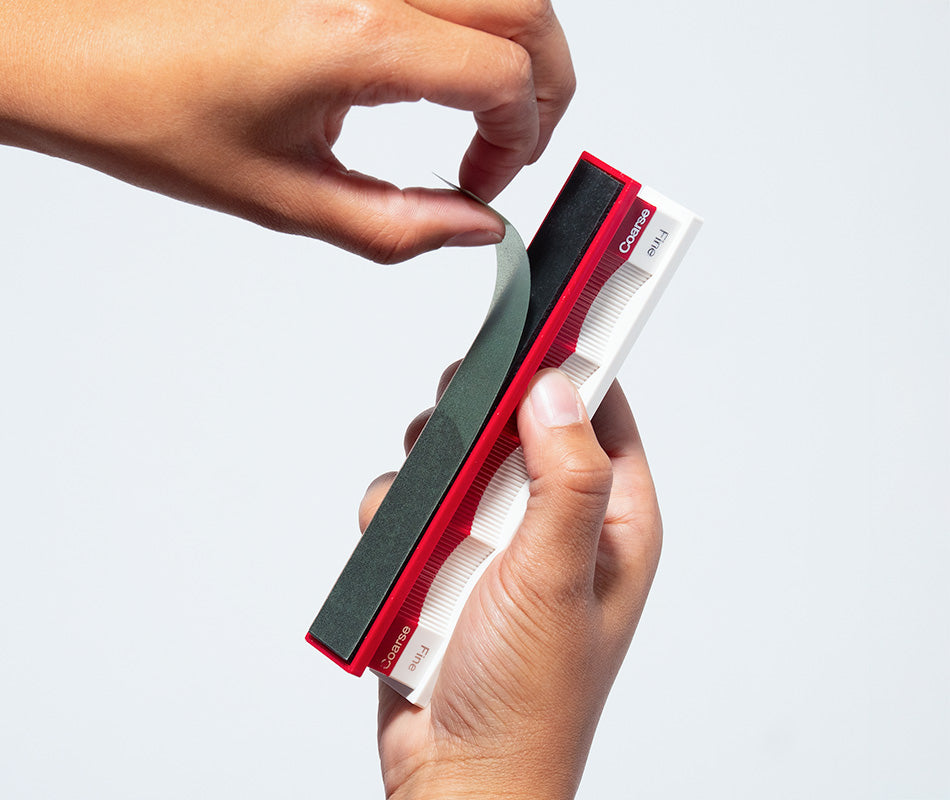 Blank Convex Edge Handles in hands at close-up from front angle.
