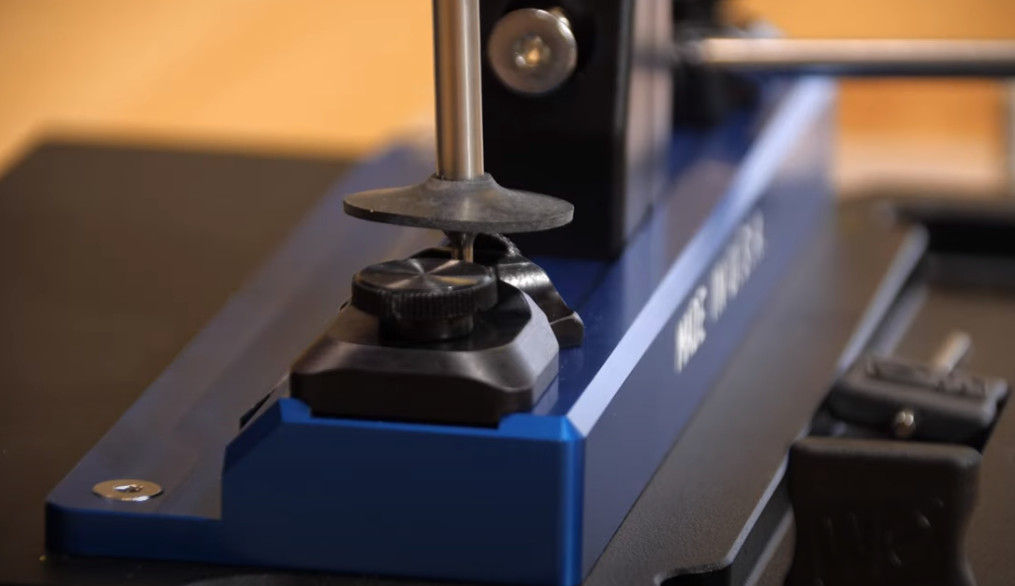 Guide Rod Shield Pack mounted on Wicked Edge sharpener at close-up from side angle.